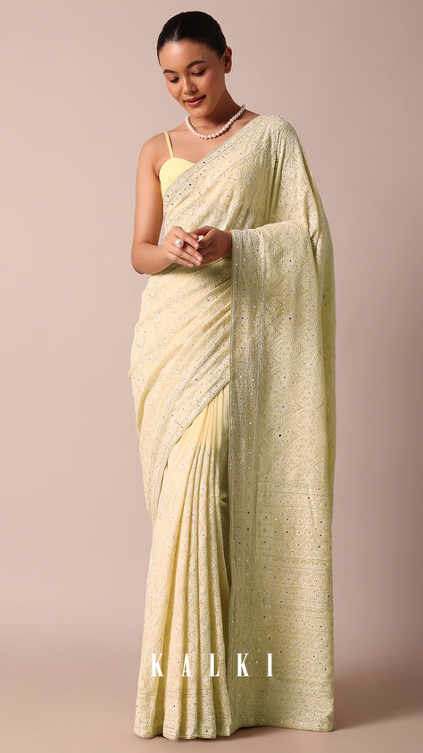 A show-stopping style that will win you endless compliments is this beautiful yellow saree. Crafted from georgette fabric, it is adorned with all over sparkly sequin embellishments. Elevated with detailed craftsmanship and Lucknowi chikankari work, it is paired with an unstitched blouse piece. Lucknowi Saree, Lucknowi Chikankari Saree, Sari India, Chikankari Saree, Chikankari Work, Yumna Zaidi, Lucknowi Chikankari, Yellow Saree, Georgette Fabric