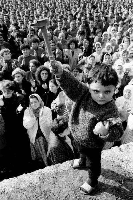 A young Turkish boy raises up a hammer during a solidarity rally for the 42000 miners on strike in  Zonguldak coal fields, November 1990. Coal Miners, Art Brut, Foto Vintage, Foto Art, Documentary Photography, Bw Photo, Photojournalism, Vintage Photography, Historical Photos