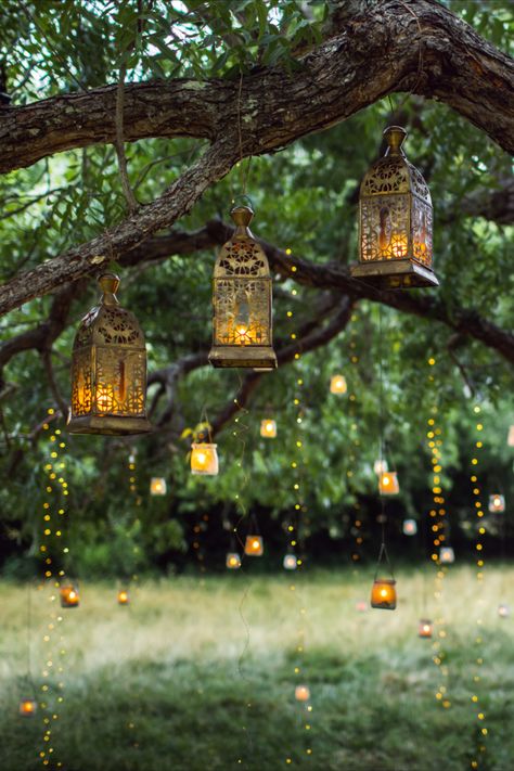 Wedding Decor | Beautiful ways to add lighting to outdoor events.  You can use fairy lights, string lights, candles, hanging candles, led lights, lanterns and more! Fairy Tree Lights, Backyard Wedding Lanterns, Fairy Lights On Trees, Tree Lanterns Hanging, Forestcore Wedding, Beltane Festival, Lanterns Hanging From Trees, Sangeet Theme, Lanterns In Trees