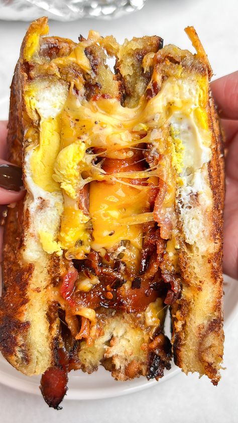 Egg-in-a-hole breakfast sandwich Bacon And Egg Sandwich Recipe, Egg In A Hole Grilled Cheese, Bacon Eggs Recipes, Croissant Bread Sandwich, Ham And Bacon Sandwich, French Bread Breakfast Sandwich, Folded Egg Sandwich, Fancy Breakfast Sandwich, Pork Belly Breakfast Sandwich