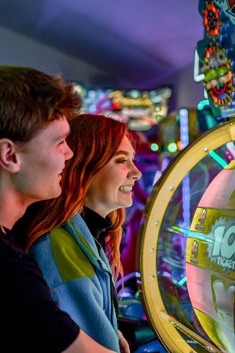 Themed Couple Photoshoot Ideas, Couple Photoshoot Theme Ideas, Arcade Family Photoshoot, Arcade Prewedding, Playroom Photoshoot, Arcade Couple Aesthetic, Couple At Arcade, Arcade Couples Photoshoot, Board Game Photoshoot