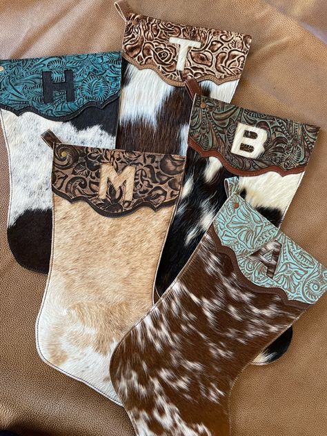 Cow Print Christmas Stocking, Western Christmas Present Ideas, Western Sitting Room, Cowboy Boot Stockings Western Christmas, Cowhide Christmas Stocking, Christmas Western Decorations, Country Western Christmas Tree Ideas, Western Stockings Christmas, Cowhide Christmas Decor