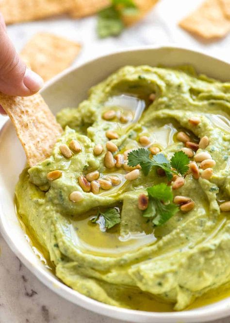 Avocado Dip in a rustic white bowl being scooped up with a corn chip Avocado Hummus Recipe, Healthy Snack Alternatives, Avocado Hummus, Avocado Dip, Recipetin Eats, Recipe Tin, Healthy Snack Options, Snack Options, Hummus Recipe