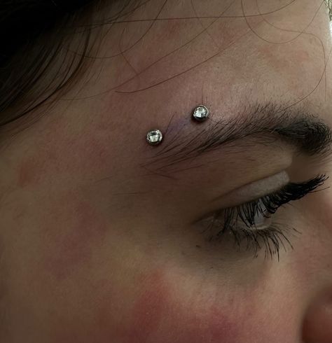 YOU MIGHT NEED THIS SURFACE PIERCING IN YOUR LIFE ‼️  HORIZONTAL EYEBROW PIERCING BY @piercernomercy_  Soho, Union Square, and Williamsburg  11AM-9PM 7 DAYS A/W🕘 WALK-INZ OR BOOK ONLINE..📕 TATTOOS & PIERCINGS, NO ATTITUDE, NO MISERABLE HOOPS TO JUMP THROUGH....🚫  WALK-INZ WELCOME OR BOOK ONLINE AT  ⚔️livebytheswordtattoo.com⚔️ . . . . #surfacepiercing #horizontaleyebrowpiercing #eyebrowpiercing #bodypiercing #soho #manhattan Eyebrow Piercing Double, Sideways Eyebrow Piercing, Eyebrow Piercing Thick Eyebrows, Horizontal Brow Piercing, Tiny Eyebrow Piercing, Septum And Eyebrow Piercing, Center Eyebrow Piercing, Types Of Eyebrow Piercings, Vertical Eyebrow Piercing