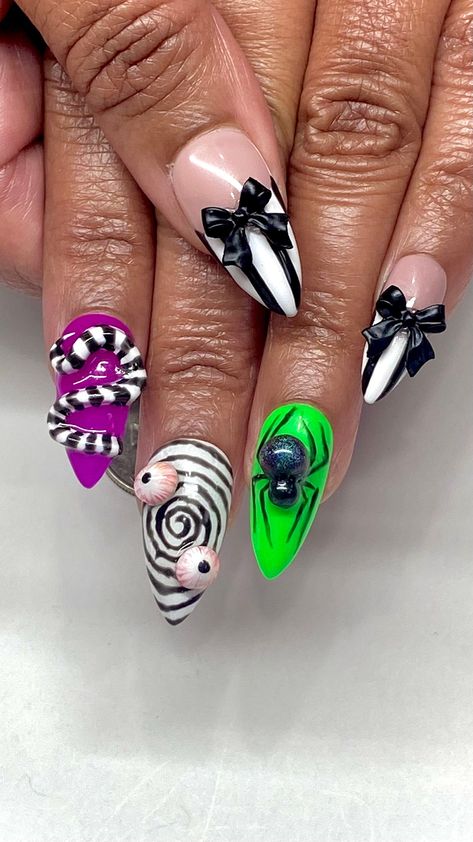 🎃 Invoke the whimsical yet spooky spirit of the iconic ghost with our Beetlejuice Inspired Halloween Gel Press On Nails. Perfect for Halloween enthusiasts and fans of the classic film, these press-on nails are designed with the distinctive black and white stripes and eerie green accents reminiscent of Beetlejuice's unforgettable suit. Whether you're attending a Halloween party, engaging in cosplay, or simply celebrating the season, these nails add a playful yet eerie touch to any costume. 👻 Key Features: 🖤 Beetlejuice-Themed Design: Each nail features bold black and white stripes with splashes of ghostly green, capturing the essence of the film's main character. 📏 Versatile Size Options: Available from extra short to long, ensuring a perfect fit for all nail types and preferences. ✨ Hi Halloween Theme Nails Short, Halloween Nail Designs Green And Black, Nail Art Themes Ideas, 3d Beetlejuice Nails, Beetlejuice Nails Coffin, Extra Halloween Nails, Joker Themed Nails, Halloween Nails Long Square, Medium Halloween Nails