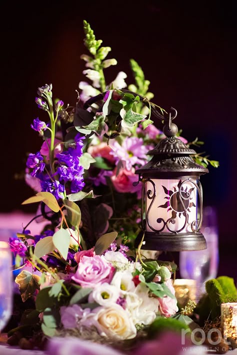 Tangled inspired wedding centerpiece at an Epcot wedding in The Living Seas Salon.  #tangled #tangledwedding #rapunzel  #root_weddings #livingseas #thelivingseas #disneywedding #disneyweddingphotographer #orlandoweddingphotographer Fairytale Wedding Centerpieces, Rapunzel Wedding Theme, Disney Wedding Decorations, Disney Wedding Centerpieces, Rapunzel Wedding, Tangled Wedding, Root Photography, Disney World Wedding, Rapunzel Party