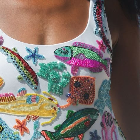 Oceanus on Instagram: "Swipe to see the story behind the new ARIZONA Swimsuit. Our Founder Hannah parked up by this Bali street food vendor and was mesmerised by the colours of the fish. ⁠ ⁠ This swimsuit is an art piece, embroidered with crystals by our highly skilled artisans.⁠ ⁠ Tap to shop this key piece of our SS24 collection.⁠ ⁠ #oceanus #fashion #swimwear⁠" Beads In Clothes, How To Embroider Beads, High Fashion Embroidery, Embroided Clothes, Beading Clothes, Beaded Swimsuit, Beaded Swimwear, Fish Clothes, Embroidered Swimsuit