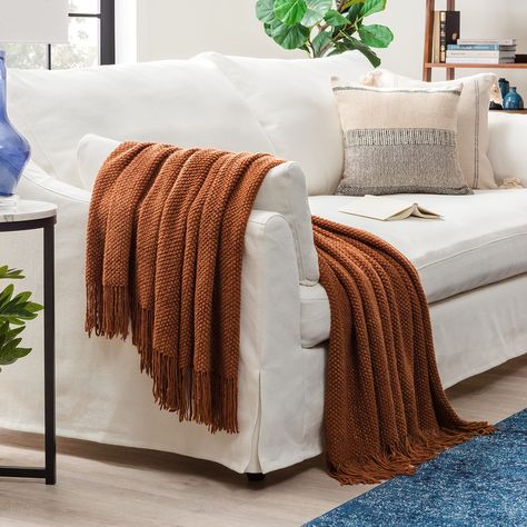 PRICES MAY VARY. 100% Polyester Cozy Accent Throw Blanket: This soft knitted blanket (50" x 65") is perfect for draping on a couch, bed, or chair; great for keeping warm Add Class with a Knitted Throw Blanket: Turn any room into a stylish space with this throw blanket’s chic and simple design Multi-Use Blanket for Your Home: This acrylic and polyester blanket is great to use as decor or to keep you warm and cozy Beautiful Blanket for Decor: Choose from an array of colors and mix and match to com Throw Blanket And Pillows On Couch, Blanket For Living Room Couch, Fall Plaid Throw Blanket, Mid Century Modern Throw Blanket, Rust Throw Blanket, Sofa Throws Styling, How To Style Throw Blanket On Sofa, Couch Throw Pillows Ideas, Couch With Blanket