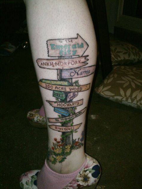 With color! My crossroad-sign tattoo w/importantly awesome book places. Road Sign Tattoo Ideas, Signpost Tattoo, Crossroad Tattoo, Road Sign Tattoo, Crossroads Tattoo, Crossroad Sign, Tattoo Quotes For Men, Country Tattoos, Sign Tattoo