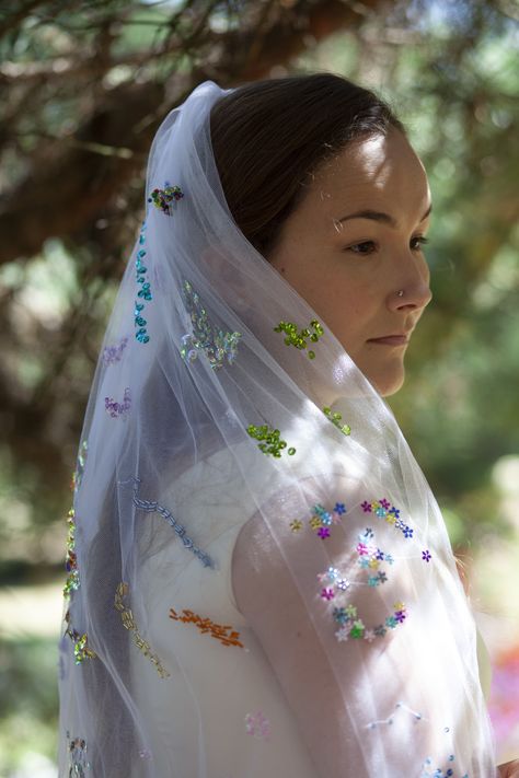 https://www.etsy.com/uk/listing/843942029/the-beaded-veil-take-2?ref=shop_home_active_3&frs=1  Handmade wedding veil covered in beautiful beads and sequins!  This stunning veil is made of three layers of white tulle, cute white pompom trimming and covered in hundreds of individually hand-stitched sequins and beads. It will sit on your hair using a sturdy plastic hair comb. It is about 60cm long (so elbow-length if you attach it to the middle of your hair). Beaded Veil, Beaded Rainbow, Beaded Veils, Rainbow Wedding, White Tulle, Rainbow Beads, Wedding Veil, Handmade Wedding, Hair Comb