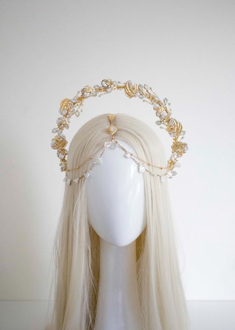 Gold Leaves Pearls Halo  Crown - Panmilli - only for adult! This crown will be a great addition to the fine art photography, wedding, it is suitable as a prop for pregnancy photo-shoot, enhance your festival outfit, fort make-up artist, Ball, Party... This romantic headband is handcrafted using an array of gold metal You will love this headdress and it will serve you well. Package : 1 pcs Hairband Color: Gold *We used clear and opal crystal gemstones, Natural and Imitation Pearls on gold halo headpiece. The Halo Headpiece from Panmilli are works of art, each piece is made by hand with love and passion Thank you for your interest and we look forward to your order :) You can find more crowns in our shop: www.panmilli.etsy.com You can start following us on the instagram: www.instagram.com/pan Ethereal Headpiece, Roman Headpiece, Goddess Headpieces, Forehead Crown, Branch Headpiece, Headpiece Halo, Angel Crown, Fine Art Photography Wedding, Circlet Crown