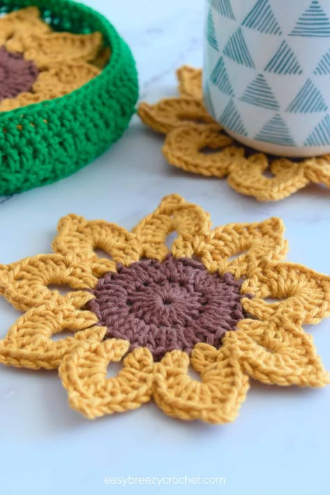 Mae's Flowers Crochet Patterns Roundup · Jo's Crafty Hook Crochet Coaster Holder Free Pattern, Small Cotton Crochet Projects, Crochet Coasters With Holder, Practical Crochet Ideas, Funny Crochet Patterns, Sunshine Crochet, Sunflower Coasters, Sunshine Crafts, Coaster Holders