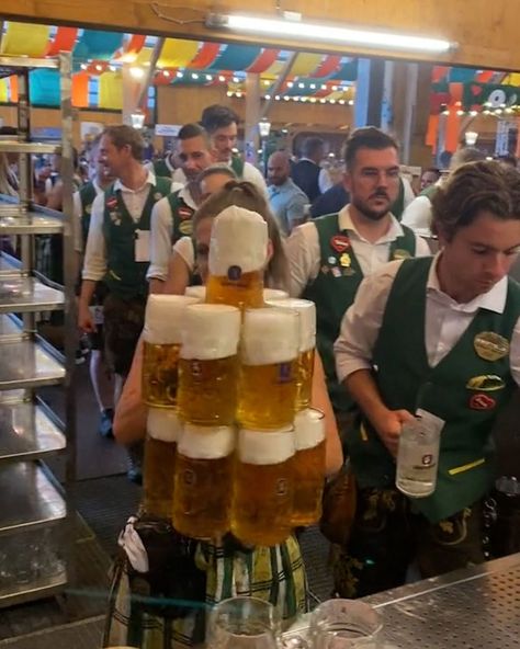 Waitress carries impressive ammount of steins Oktoberfest | waiter, Oktoberfest | How strong is she?! 😯🍺 | By LADbible | Facebook Beer