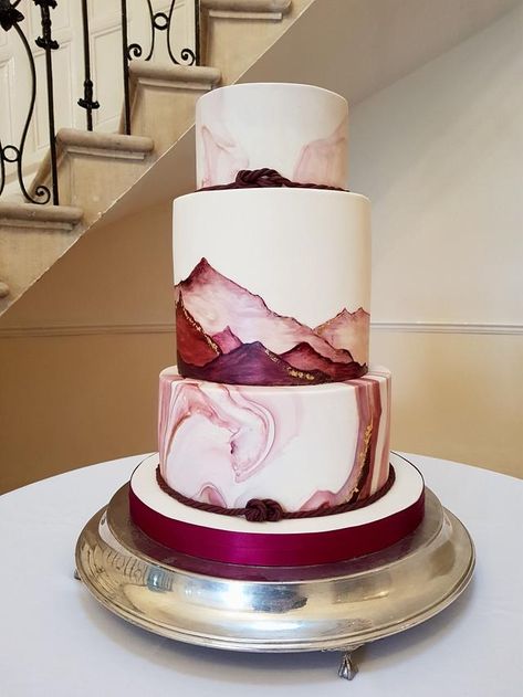 Wedding Cakes Wine Color, Simple 3 Tier Cake, Cake With Mountains, Burgundy And Gold Cake, Burgundy Wedding Cakes, Wine Wedding Cake, Burgundy Cake, Wedding Cakes Maroon, Painted Mountains