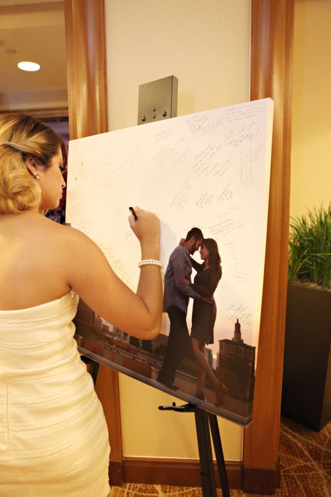 We made a canvas out of one of our engagement photos and provided sharpies for guests to sign. Wedding Wishes, Wedding Time, Here Comes The Bride, Wedding Guest Book, Fun Wedding, Wedding Bells, Guest Book, Unique Weddings, Future Wedding