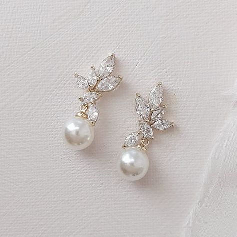 Exquisitely crafted, these luminous pearl drop bridals earrings will  illuminate your look. Featuring cubic zirconia stones in a leaf-like arrangement and finished with a lustrous creamy pearl. Details Length 3cm Width 1.2cm All our jewellery comes perfectly packaged in our custom jewel box. Pearl Drop Bridal Earrings, Pearl Drop Earrings Wedding, Drop Bridal Earrings, Bridal Drop Earrings, Drop Earrings Bridal, Pearl Drop Earrings Bridal, Teardrop Bridal Earrings, Bridal Earrings Studs, Bridal Statement Earrings