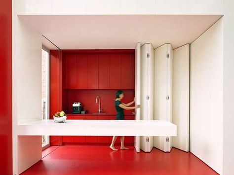 Photos of Folding Doors For Small Spaces collapsible walls for upstairs kitchen Doors For Small Spaces, Red And White Kitchen, Moving Walls, Micro Apartment, Hidden Kitchen, Folding Walls, Space Saving Kitchen, Vogue Uk, Folding Doors