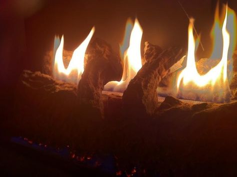 How to make a fake fire for a faux fireplace Faux Fireplace Lights, Diy Fake Flames Faux Fireplace, Faux Fire In Fireplace, How To Make A Fake Fireplace Look Real, How To Make A Fake Fire, Fake Fireplace Wall Ideas, Fake Fire For Fireplace, How To Make A Fake Fireplace, Diy Faux Fire