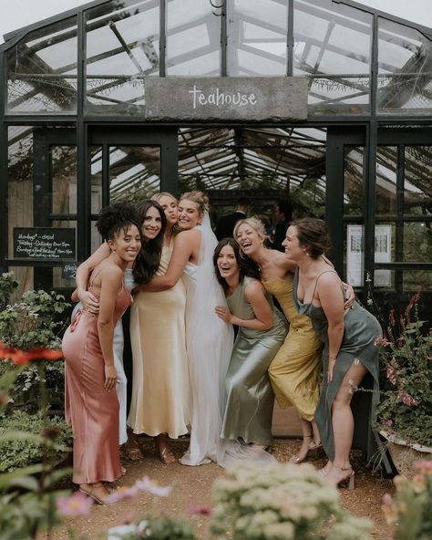 Fun, joy-filled bridal party photo with mix and match bridesmaids dresses, captured at internationally prized garden centre Petersham Nurseries, Surrey, 

Image Maja Tsolo Mix And Match Bridesmaids, Rustic Romance Wedding, Fun Bridal Party Photos, Petersham Nurseries, Tranquil Garden, Wedding Gift List, Richmond Park, London Venues, Rustic Romance