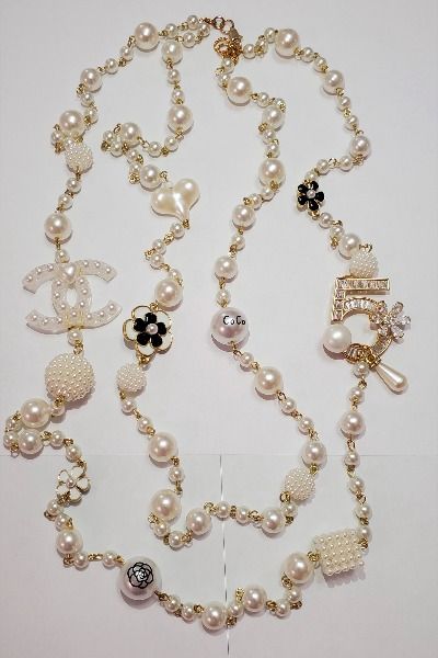 Price- 150.00 Necklace Handmade Inspired by Chanel Classic White 2 row beads , pearls white , Camellias, charms. Necklace length- 36.5" #Chanelgirl #Chanel #cocochanel #chanel #ribbon#gift#necklace#gift#LongNecklace##DIYNecklace Chanel Ribbon, Chanel Necklace, Chanel Pearls, Ribbon Gift, Chanel Inspired, Charms Necklace, Charm Necklaces, Necklace Handmade, Coco Chanel