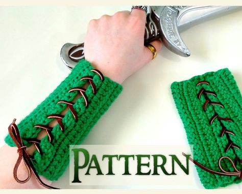 This is a crochet Halloween pattern, NOT the archery bracers themselves. If you would like to purchase a completed set visit: https://www.etsy.com/listing/261230164/elven-bracers-woodland-elf-costume?ref=shop_home_feat_1 The fantasy world has long been one in which many people have wanted to be a part of. Designing these woodland elf archery bracers has allowed me, as well as others, to be one step closer to that world. While we weren't all born woodland elves we can at least spend our days imag Woodland Elf Costume, Archery Bracer, Crochet Pour Halloween, Costume Green, Woodland Elf, Elf Cosplay, Crochet Fairy, Fest Outfits, Halloween Crochet Patterns