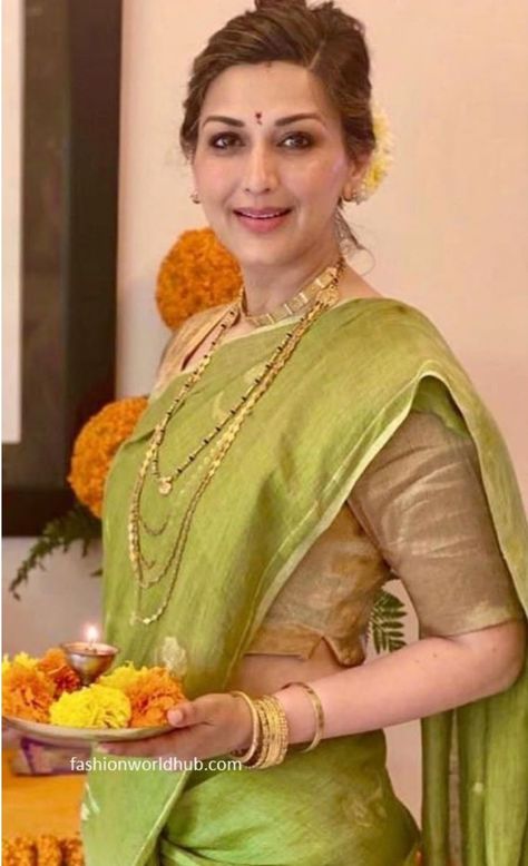 Sonali in traditional attire with green saree and golden blouse and knot in her hair style and gold Jewellery, a nice attire for Pooja Green Sari With Contrast Blouse, Green Saree Jewellery Ideas, Light Green Saree With Contrast Blouse, Saree For Pooja, Golden Saree With Contrast Blouse, Satin Saree Blouse, Golden Blouse Designs, Farewell Saree, Saree Pose