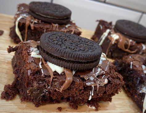 Signature Gooey indulgent cookies and cream brownie. Loaded with cookies, which and milk chocolate and topped with even more cookies!  8 pieces per order. Indulgent Cookies, Loaded Cookies, Brown Food, Baked Good, Cookies And Milk, Yummy Comfort Food, Sweet Snacks Recipes, Baked Dessert Recipes, Food Drinks Dessert