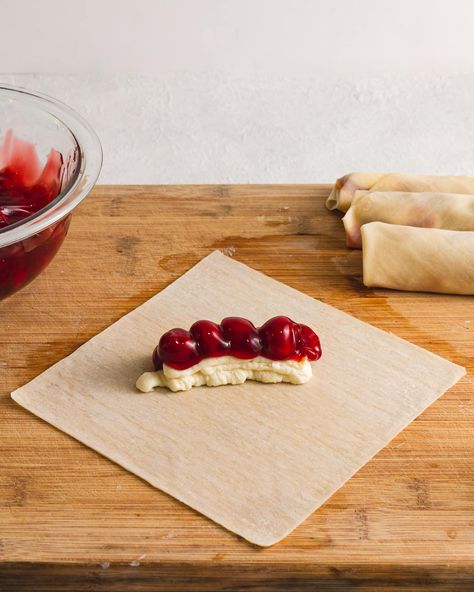 Cherry Cheesecake Egg Roll recipe - Happy Homeschool Nest Cheesecake Spring Rolls, Cherry Cream Cheese Egg Rolls, Cherry Egg Rolls, Desert Egg Roll Recipes, Egg Roll Wrapper Recipes Easy, Sweet Egg Rolls, Cherry Cheesecake Egg Rolls, Dessert Egg Roll Recipes, Dessert Egg Rolls Recipe