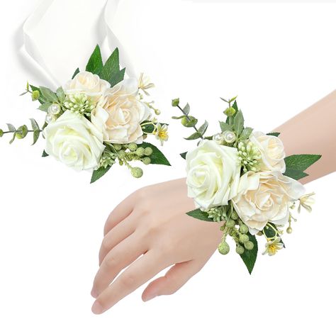 PRICES MAY VARY. ❤️【Ivory Wrist Corsage】: The wrist corsages consist of white rose, ivory rose, ivory gardenia flowers, artificial pearls and tiny flowers, with ribbons, easy to wear, comfortable and firm, fits most wrist sizes. Perfect for bride and bridesmaid, mother and grandmother of bride and groom, or any other important families and guests. ❤️【Package and Size】: You will get 6pcs wedding wrist corsage with box package, wrist flower head size: 5.9 inch x 5.1 inch. We suggest you could orde Flowers For Mother Of The Bride, Wrist Bouquet Wedding, Wrist Corsage Wedding Mothers, Prom Corsage Red, Corsages For Wedding, Corsage Wedding Mother, Hand Corsage, Gardenia Flowers, Homecoming 2024