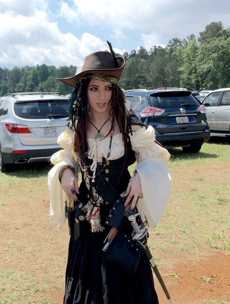 My lady pirate costume this year for ATL Renaissance Festival. Handmade dreadlocks, hand sewn outfit, vintage scarves, handmade hair piece, replica sword and pistols, handmade hat, vintage jewelry. Goth Pirate Costume, Realistic Pirate Costume, Pirate Hat Women, Lady Pirate Aesthetic, Fancy Pirate Outfit, Pirates Outfit Female, Simple Pirate Costume Women, Female Pirate Costume Diy, Pirate Jewelry Aesthetic