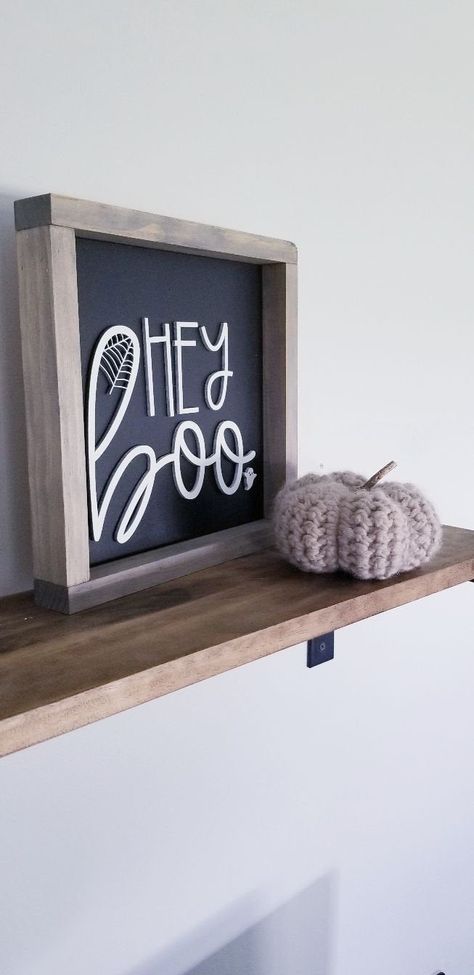 "This 3D Hey Boo Halloween sign is the perfect small piece to switch out with every season. The lettering is laser cut for a dimensional look. MEASUREMENTS + MATERIALS *This sign measures approx 10\"x10\" *Hanging hardware is included with all signs *Each piece of wood is unique, and there may be slight variations in each sign *This design is painted and distressed, if you prefer no distressing we will use permanent matte black lettering for a crisp clean look PERSONALIZATION *We LOVE custom ord Shelf Decor Black, Fall Shelf Decor, Boo Halloween Sign, Hey Boo Halloween, Spooky Woods, Halloween Bathroom Decor, Ghost Decor, Treats Halloween, Modern Farmhouse Wall Decor