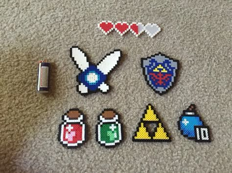 Legend Of Zelda Perler Beads, Zelda Perler Beads, Zelda Pixel Art, Zelda Perler, Harry Potter Perler Beads, Hylian Shield, Hamma Beads Ideas, Pixel Beads, Perler Ideas