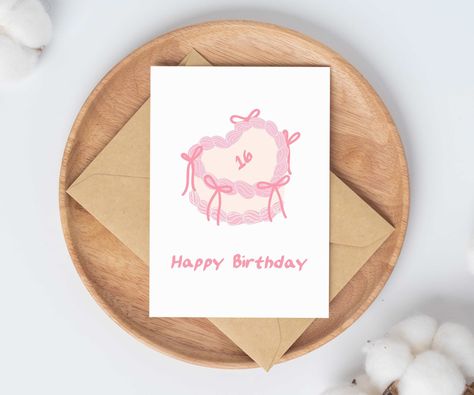 This flirty aesthetic birthday card is perfect for teenage girls on their sweet sixteen. Featuring a cute pink bow birthday cake, this card is simple and classy for her 16th birthday party or celebration. Perfect for teenage daughter, card for granddaughter, or birthday gift for friend. ✰ ✰ ✰ ABOUT THE PRODUCT ✰ ✰ ✰ - Size: 4.25 x 5.5 closed (8.5 x 5.5 opened) - Includes kraft brown envelope (self-seal) - All cards are blank on the inside ✰ ✰ ✰ GIFT MESSAGES ✰ ✰ ✰ Want to add a personalized mess Pink Bow Cake, Bow Birthday Cake, 20th Birthday Card, Coquette Birthday, Birthday Cards For Girlfriend, Bow Birthday, 16th Birthday Card, Birthday Gift For Friend, 30th Birthday Cards