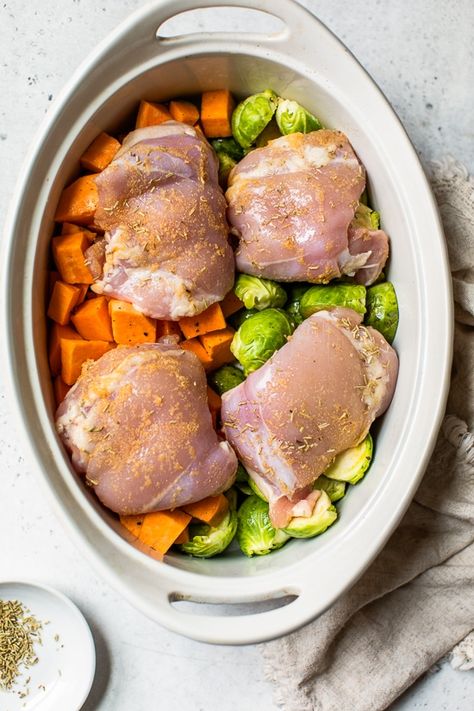 Baked Chicken Thighs with Brussels Sprouts and Sweet Potato, a quick and easy one-pot chicken dinner for a chilly, fall night. #onepotchicken #chicken #chickendinner #onepotrecipes #brusselssprouts #butternut Crock Pot Sweet Potatoes, Sprouting Sweet Potatoes, Crockpot Chicken Thighs, Fall Night, Chicken Sweet Potato, Baked Chicken Thighs, Crockpot Recipes Slow Cooker, Chicken Dishes Recipes, Sweet Potato Recipes