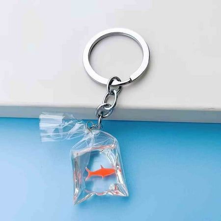 Clear Resin Fish Cute Resin Fish Key Chain Water Bag Fish Key Ring Features: 6 colors to choose from GOLD FISH PENDANT - This gold fish is surrounded by clear resin, looks like a fish playing happily in the water. It is lifelike and vivid, which makes this pendant more interesting and perfect gift for your family and friends. RELIABLE MATERIAL -- Each keychain is made of resin, comfortable and durable. You can pair it with an organza bag or small velvet and thank your guests with a variety of small items such as candies, giveaways and other gifts. EASY TO USE -- With the iron split key ring, you can easily link the fish to earring hooks, bracelets, necklaces, chains, key rings, etc., you can easily get decorations with your own style, use you to start DIY. WIDE USE - You can turn them into Bumble Bee Decorations, Transparent Fish, Fish Cute, Fall Room Decor, Small Stuffed Animals, Bag Keychain, Holiday Savings, Christmas Clearance, Transparent Resin