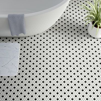 Transform your space into a tribute to retro design with our Metro Hex Matte White with Black Dot 10-1/4 in. x 11-7/8 in. Porcelain Mosaic Floor and Wall Tile. As a modern deviation from the classic hexagon mosaic, this tile option is a throwback to traditional retro design with a contemporary feel. Matte white hexagons are accented by contrasting black chips and precisely arranged on an interlocking mesh to create a seamless installation. This minimalistic geometric porcelain mosaic is unique y Penny Tiles Bathroom, Hex Tile, White Bathroom Tiles, Penny Tile, Merola Tile, Black And White Tiles, Porcelain Mosaic Tile, Hexagonal Mosaic, Hexagon Tiles