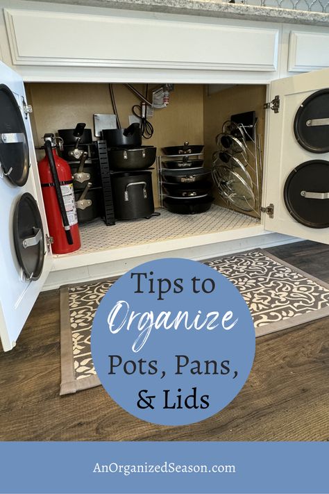 Tired of digging through your kitchen cabinets to find the right pot or pan? We've got you covered with our easy and practical tips to organize pots, pans, and lids 🍳 Discover space-saving solutions and stylish storage ideas for your cookware! 💖 Please pin this and follow us for more home organization inspiration! 😉 Under Sink Pots And Pans Storage, Organize Pots And Pans, Pan Storage Diy, Pot Lid Storage, Stacked Pots, Kitchen Cupboard Organization, Under Kitchen Sink, Under Kitchen Sink Organization, Cookware Storage