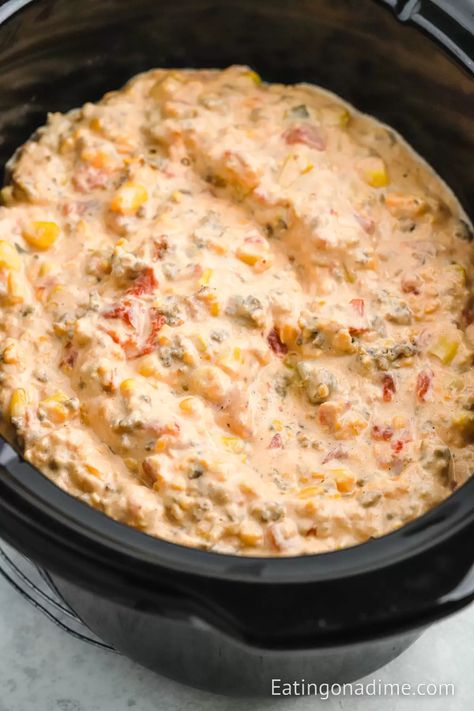 Crock Pot Cowboy Crack Dip is the perfect dip to serve for any occasion. You only need a few ingredients to make this flavorful dip. This spicy and creamy dip is a crowd favorite. It is perfect for large crowds and perfect for dipping your favorite tortilla chips in. #eatingonadime #crockpotcowboycrackdip #cowboycrackdip Ranchero Party, Spicy Sausage Dip, Dip Recipes Crockpot, Slow Cooker Dips, Chip Dip Recipes, Dip Recipes Hot, Slow Cooker Sausage, Sausage Dip, Crock Pot Dips