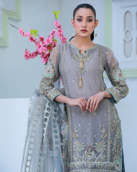 Shine in our grey dress from the Laadli Collection. The long shirt, adorned with Adda work, offers a touch of modern elegance. Ideal for those seeking a fresh, standout look with a subtle shimmer. Elevate your special occasion with this captivating piece. Tap the link in bio 🛍️ . . . #aqsabyshehzad #Embroided #festive #Trending #fashion #GlamourandStyle #shopnow Grey Dress, Trending Fashion, Long Shirt, Modern Elegance, Touch Of Modern, Gray Dress, Link In Bio, Tap, Special Occasion