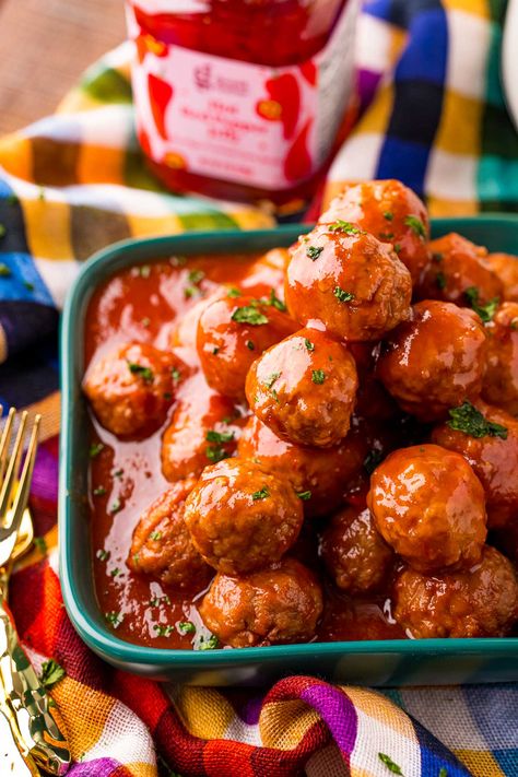 This Hot Pepper Jelly Meatballs recipe combines frozen meatballs, raspberry jam, chili sauce, red pepper jelly, and orange juice to make a sweet and spicy appetizer! Simply toss the ingredients into the crockpot and your work is done! Hot Pepper Jelly Meatballs, Red Pepper Jelly Meatballs, Pepper Jelly Meatballs Crock Pot, Hot Pepper Jelly Recipe Appetizers, Red Pepper Jelly Recipe Appetizers, Pepper Jelly Meatballs, Jelly Ideas, Red Pepper Jelly Recipe, Jelly Meatball Recipe