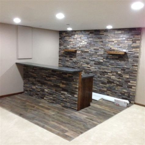 Adorn® Mortarless Stone Veneer Siding is perfect for those interior projects - check out this bar installed with our Ledgestone Series stone in Buckskin. Stone Basement Bar, Accent Wall Bar Area, Stone Bar Ideas, Basement Den, Basement Bars, Stone Veneer Siding, Stone Accent Walls, Wall Feature, Rustic Bathroom Designs