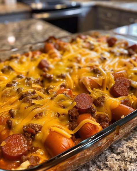 Lay some hotdog buns in a casserole dish and in no time, you'll have a dinner to die for Hot Dog Casserole, Baked Hot Dogs, Chili Dog Casserole, Chili Cheese Dog Casserole, Chili Cheese Dogs, Cheese Dog, Beef Casserole Recipes, Hot Dog Recipes, Chili Cheese