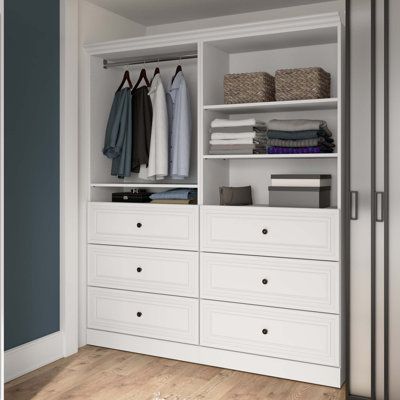 This freestanding closet system adds plenty of extra storage to your bedroom or guest room. The frame is crafted from engineered wood with laminate veneers in a neutral finish, and it rests on a plinth base. Its expansive silhouette measures 85" tall by 71.5" wide, and it features crown moldings, recessed paneling, and silver-finished hardware for a traditional look in your space. Six drawers and four open compartments let you stage, stash, and store all the essential pieces of your wardrobe. Th Bestar Closet, Closet Behind Bed, Clothes Storage Solutions, Closet Organizer With Drawers, Free Standing Closet, Closet Systems, Closet Renovation, Open Closet, Closet Drawers