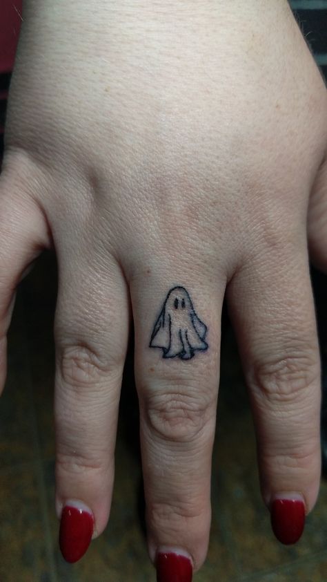 Fine line micro finger tattoo done by the queen of Kent Christine Zwick at Defiance Tattoos in Kent Ohio. Finger Ghost Tattoo, Pumpkin Finger Tattoo, Ghost Hunting Tattoo, Hidden Finger Tattoo, Spider Web Finger Tattoo, Halloween Hand Tattoo, Ghost Finger Tattoo, Stick And Poke Finger Tattoo, Halloween Finger Tattoos