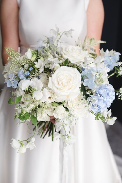 On the blog this week, the story of Robyn and Chris's elegant rustic luxe wedding at the unique Crumplebury venue with dreamy pale blue and white floral broken arch, bouquets and buttonholes. Light Blue And White Roses Bouquet, Light Blue Wedding Theme Flowers, Blue And White Bridal Bouquet Hydrangeas, Blue White Wedding Bouquet, Coastal Bridal Bouquet, White And Blue Bouquet Wedding, Mist Blue Wedding, White And Blue Wedding Bouquet, Blue Floral Arrangements Wedding