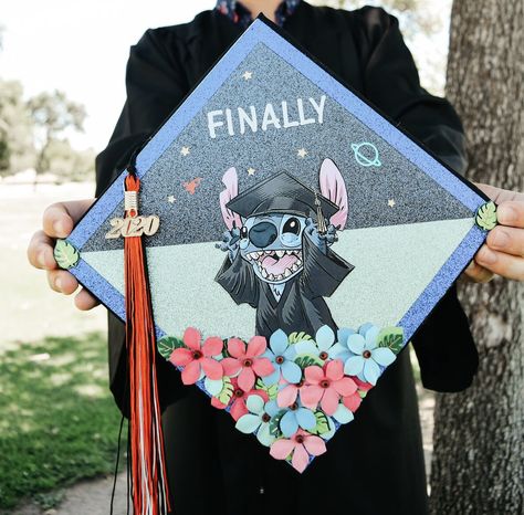 Disney’s Stitch themed graduation topper Up Cap Graduation, Grad Cap Ideas Lilo And Stitch, Decoration Cap Graduation, Graduation Cap Cartoon Designs, Grad Cap Ideas Stitch, Stitch Graduation Party Ideas, Lilo And Stitch Grad Cap, Graduation Topper Ideas, Cap Decorations For Graduation