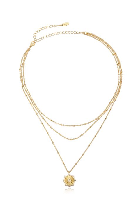 Gold necklace layered