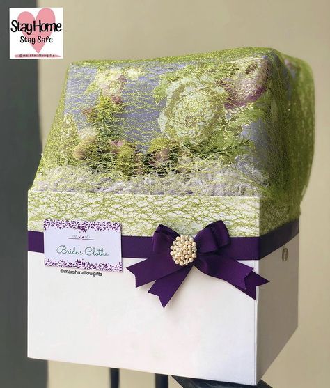 Bride’s cloths wrapped in a white box with purple ribbon and green bow for engagement dowry wrapping. Traditional African Wedding, Green Bows, Purple Ribbon, African Wedding, White Box, Bottle Crafts, Gift Wrapping, Ribbon, Purple