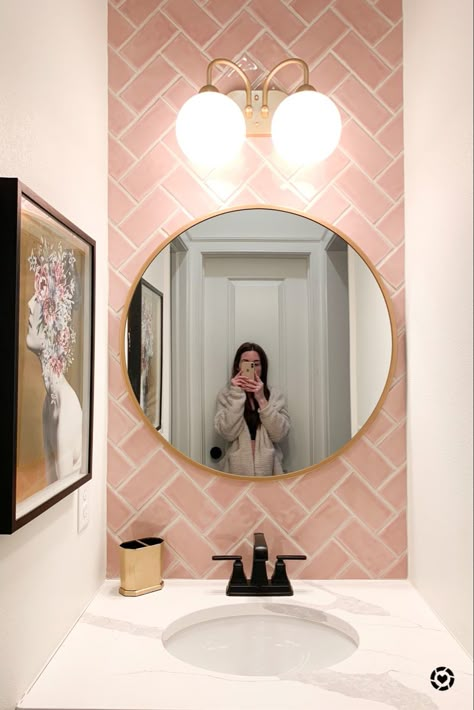 Pink accent tile wall. Adorable half bath vanity area with pops of gold. Sweet style. Pink And Gold Tile Bathroom, Pink Wc Small Bathrooms, Bathroom Ideas Pink And Gold, Ensuite Bathroom Ideas Pink, Pink Herringbone Tiles Bathroom, Small Bathroom Pink Tiles, Toilet Pink Tiles, Pink Wc Ideas, Girls Ensuite Bathroom