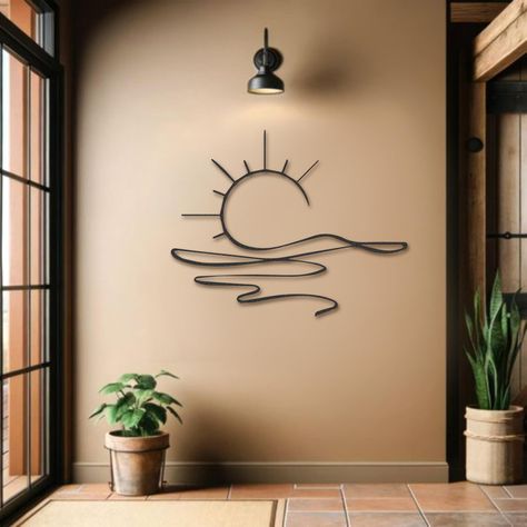 PRICES MAY VARY. STYLISH DESIGN: This beautiful metal wall art was created by processing the perfect sunset view into 2 mm thick metal with wonderfully elegant workmanship. INDOOR & OUTDOOR VERSATILITY: Perfect for both indoor and outdoor use, this metal sculpture complements any decor. Use the included screws to hang it in your living room, bedroom, porch, patio, or entryway, adding a touch of elegance and charm. PERFECT GIFT FOR ANY OCCASION: This sunrise metal wall decor is an ideal gift for Boho Outdoor Wall Decor, Wall Hanging Over Bed, Outside Wall Decor Ideas, Crystal Wall Decor, Moon Phase Wall Art, Funny Bedroom Decor, Whimsical Wall Decor, Room Decor For Men Bedroom, Metal Design Art